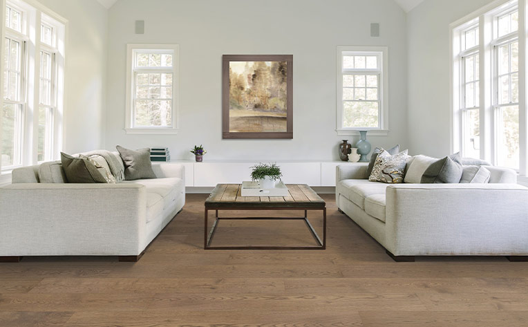 warm toned hardwood flooring in living room